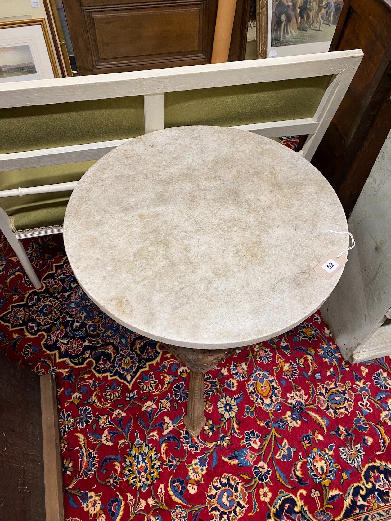 A Victorian style circular cast iron pub table with reconstituted marble top, diameter 60cm, height 73cm